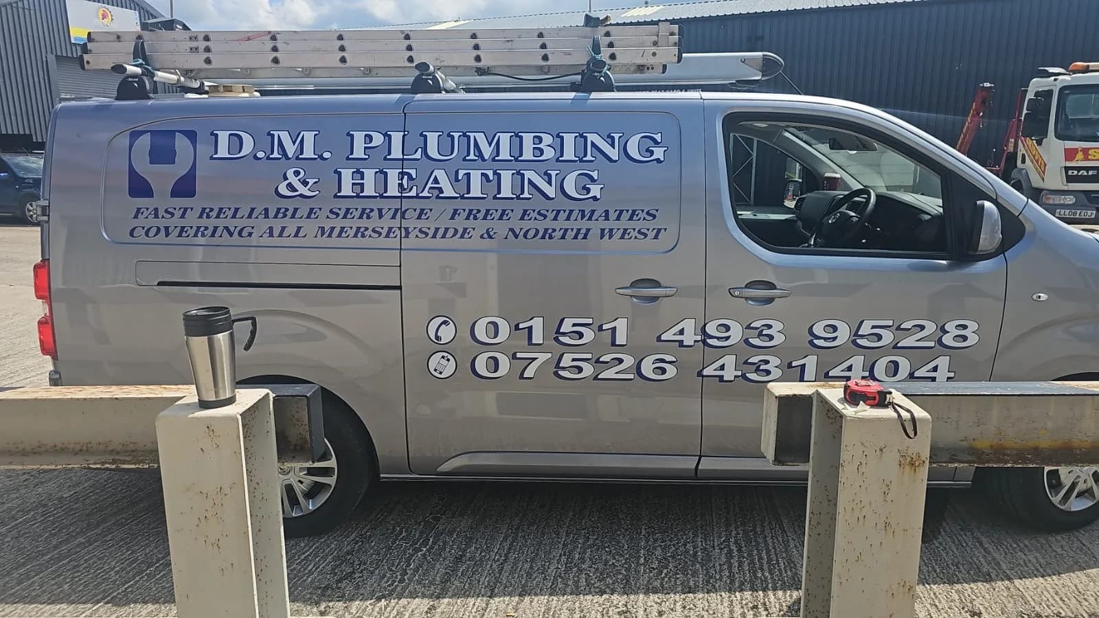 D.M. Plumbing & Heating van with full business branding and telephone numbers